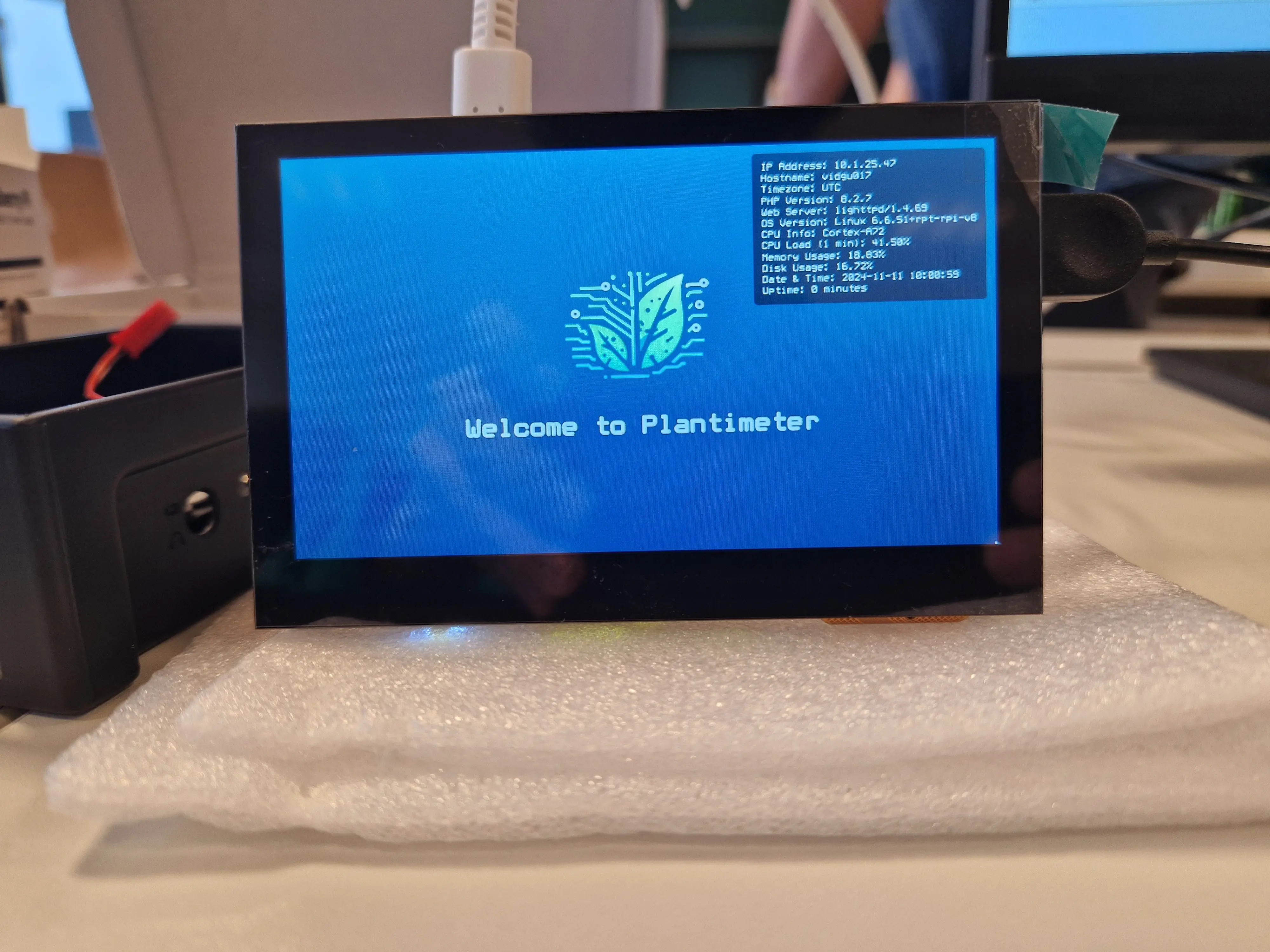 Raspberry Pi 4 with touchscreen display showing the Plantimeter dashboard